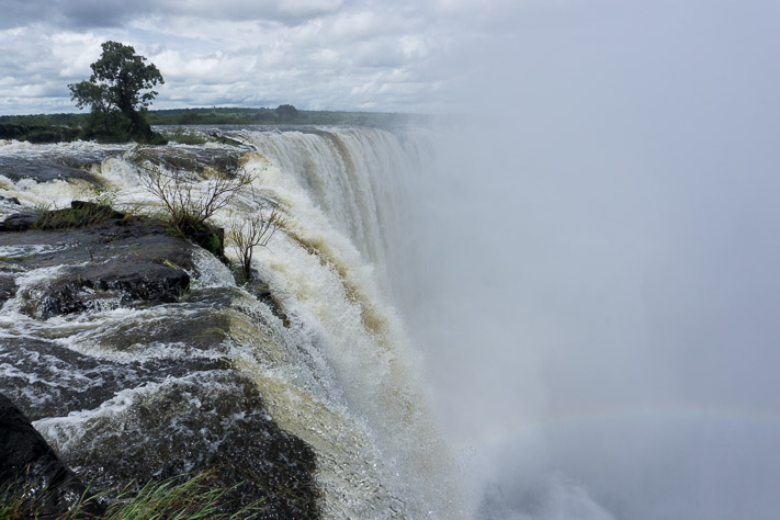 Sitting at the edge of Victoria Falls